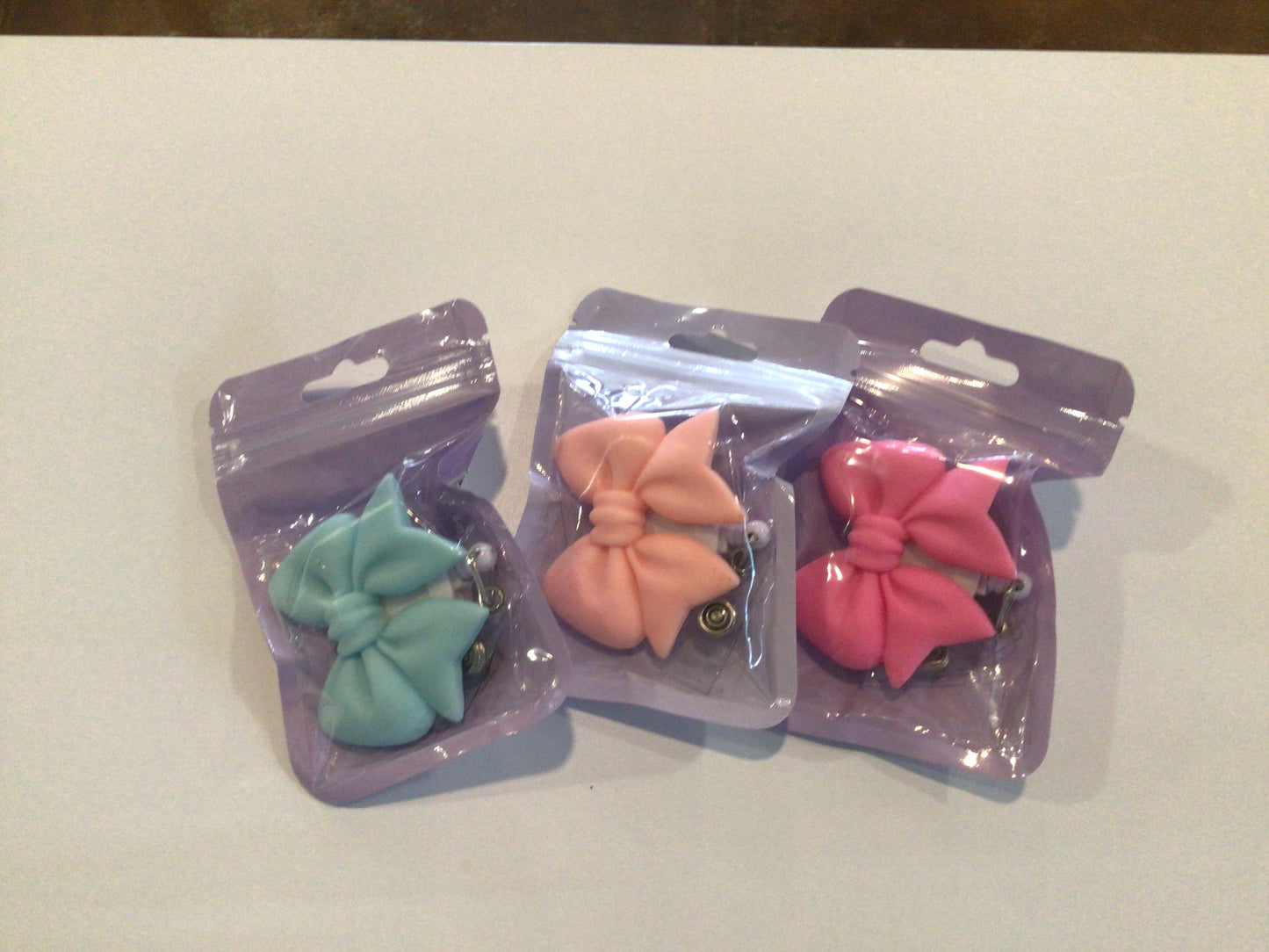 Bow badge reels