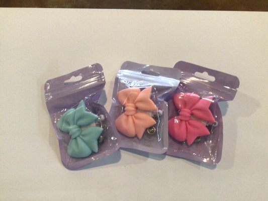 Bow badge reels