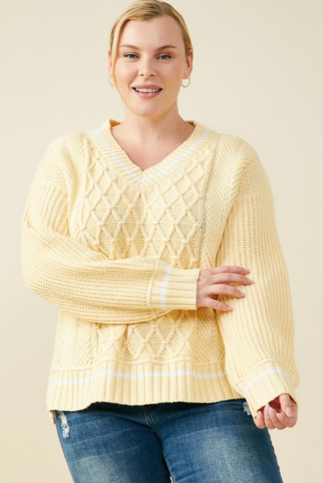 Women’s yellow cable knit sweater front view

Cozy V-neck knit pullover in yellow

Casual fall outfit with cable knit sweater
