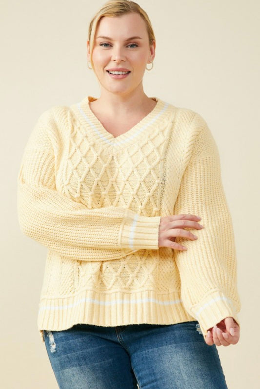 Women’s yellow cable knit sweater front view
Cozy V-neck knit pullover in yellow
Casual fall outfit with cable knit sweater